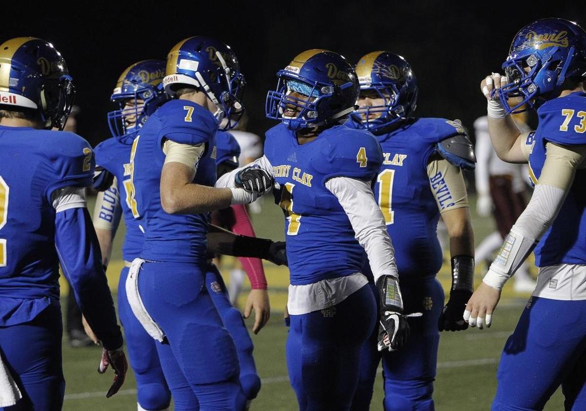 Henry Clay's Tyree Clark is congratulated by Noah Gann, left, following his fumble recovery against Cooper at Dr. Robert Feld Stadium in Lexington, Ky., Friday, October 27, 2017.