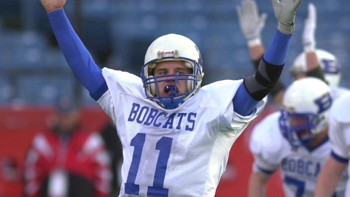 Breathitt County quarterback Justin Haddix thrusts his arms into the air after throwing a touchdown pass during the first half of the Class 2-A state championship game against Corbin on Friday, Dec. 6, 2002, in Louisville, Ky. Haddix is now the head coach at Corbin, which visits Danville on Friday.