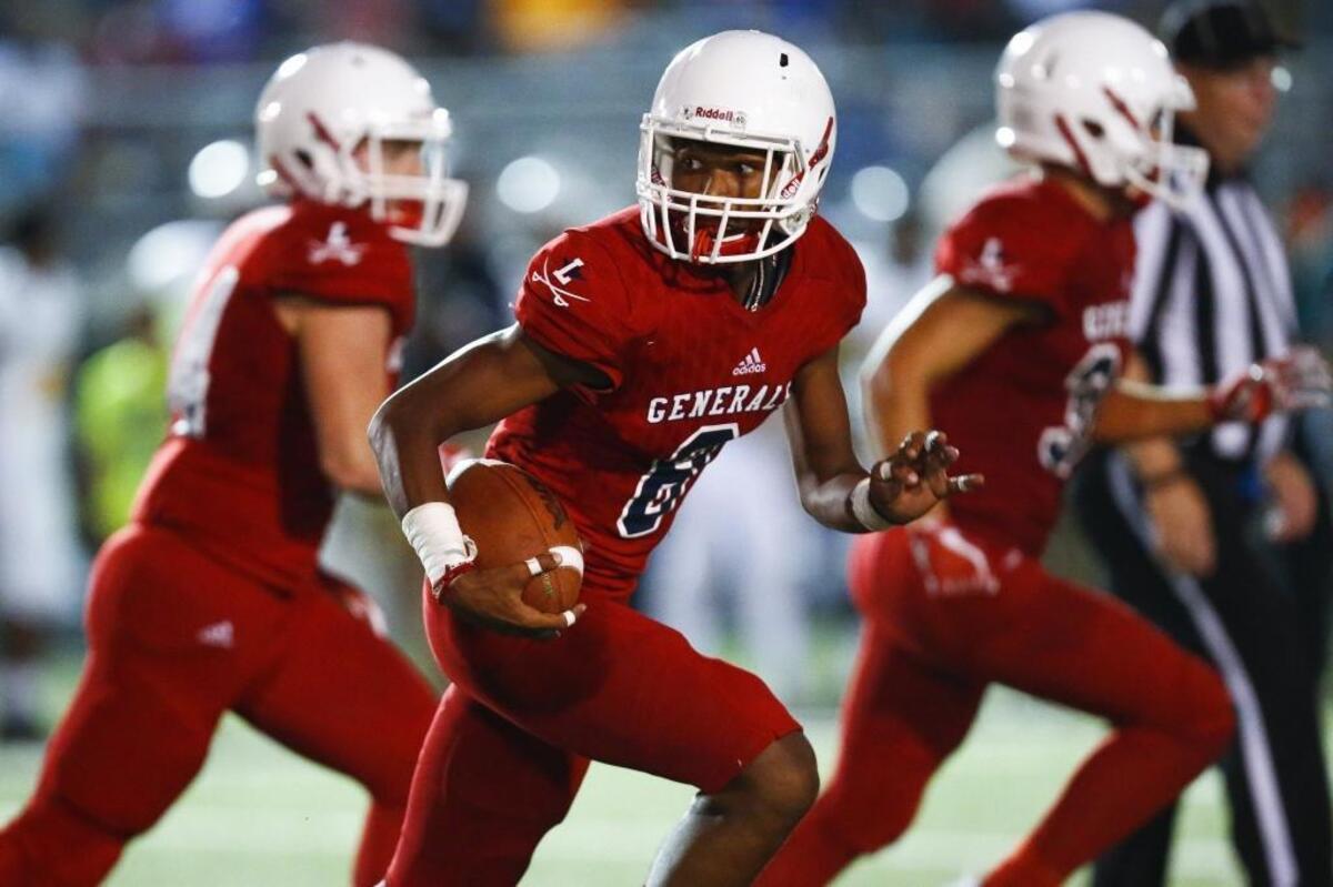 Lafayette's Jadus Smith (8) runs the ball after making an interception in the second quarter of a game against Bryan Station during the Adidas Kickoff Classic at Tates Creek High School, Friday, Aug. 18. 2017.
