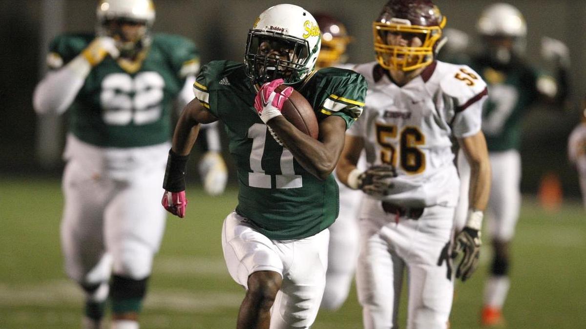 Bryan Station's Desmond Bernard makes a huge run against Cooper at R. L. Grider Stadium in Lexington, Ky., Friday, November 4, 2016.