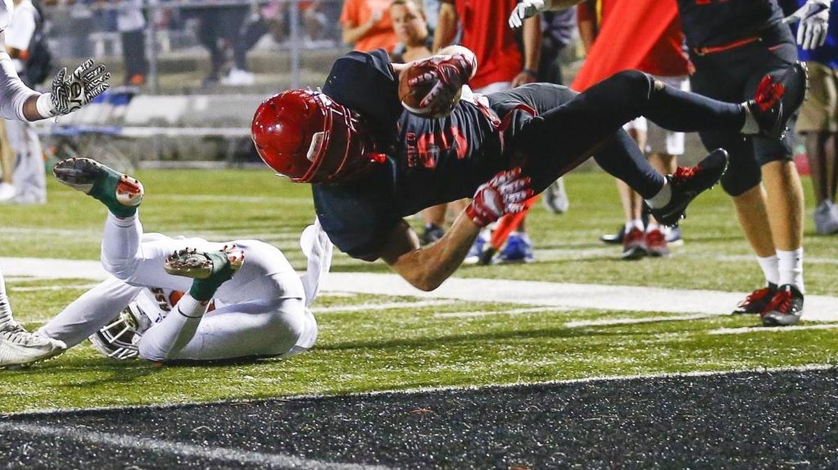 Scott County's Brice Fryman (3) scores a touchdown past Frederick Douglass' Daiyaan Perkins (19) during their game at Toyota Stadium in Georgetown, Ky., Friday, Oct. 6, 2017.