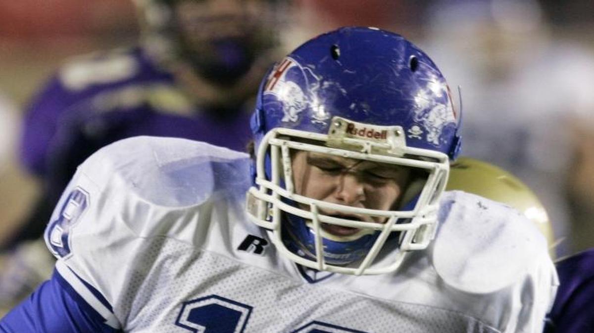 File photo: Covington Catholic running back Brent Buckley (18) is hit by Bowling Green defender Corbin Smith during the first half of the Class 3A championship football game in Louisville, Ky., on Friday, Dec. 1, 2006. That season was the most recent one in which Covington Catholic defeated Highlands.