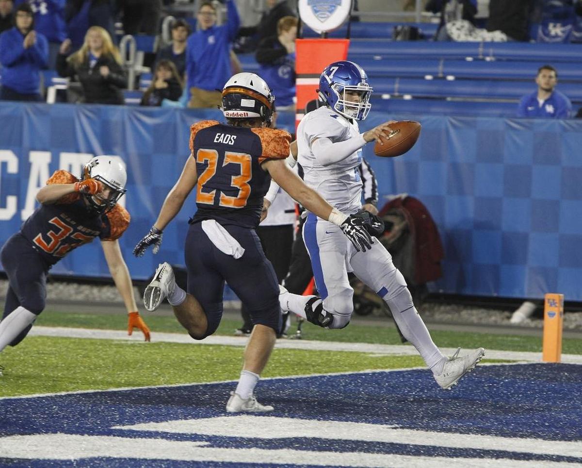 Covington Catholic's A. J. Mayer runs for a touchdown against Madison Southern in the Class 5A Russell Athletics KHSAA Commonwealth Gridiron Bowl at Kroger Field in Lexington, Ky., Saturday, December 2, 2017.