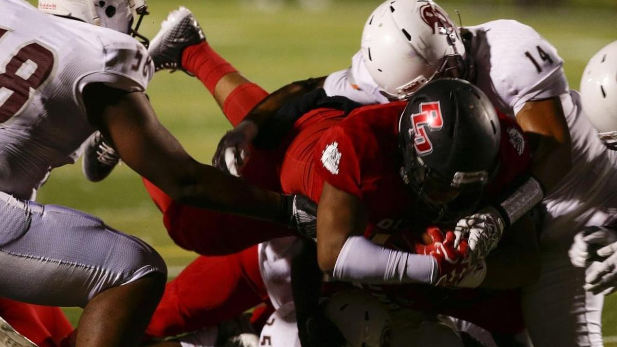 Dunbar's Amari Bracken, cut the lead to 21-14 with his second half dive as Dunbar played Tates Creek on Friday September 2, 2016 in Lexington, Ky.