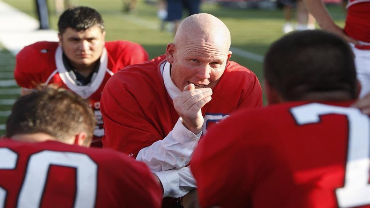Scott County football coach Jim McKee talked to his team during the Kickoff Classic at Toyota Stadium in Georgetown on Aug. 19, 2016.