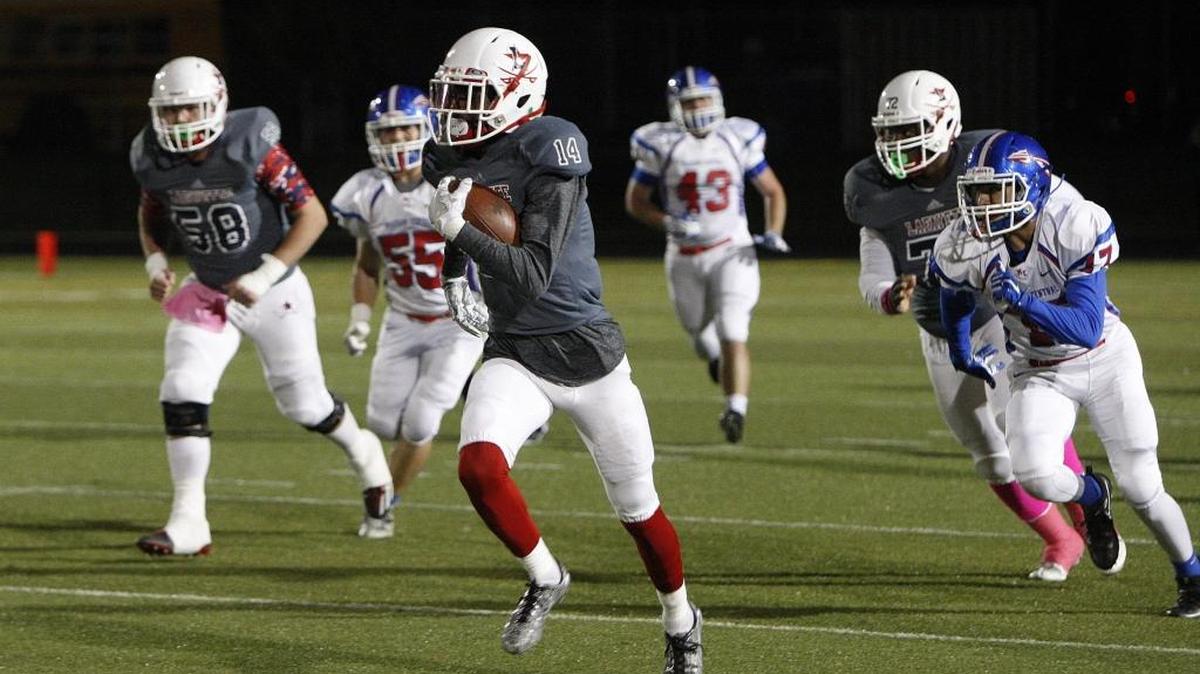 Lafayette's TeAndre Newcomb runs for a touchdown against Madison Central at Ishmael Stadium in Lexington, Ky., Friday evening, October 14, 2016.