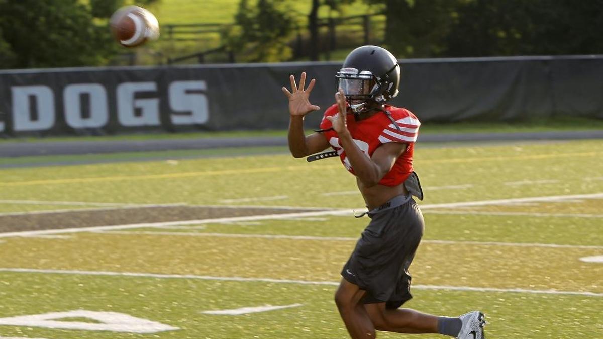 Paul Laurence Dunbar wide receiver Jamarcus Robinson makes a catch during the team’s mini-camp at Jon Akers Stadium in Lexington, Ky., Thursday evening, August 3, 2017.