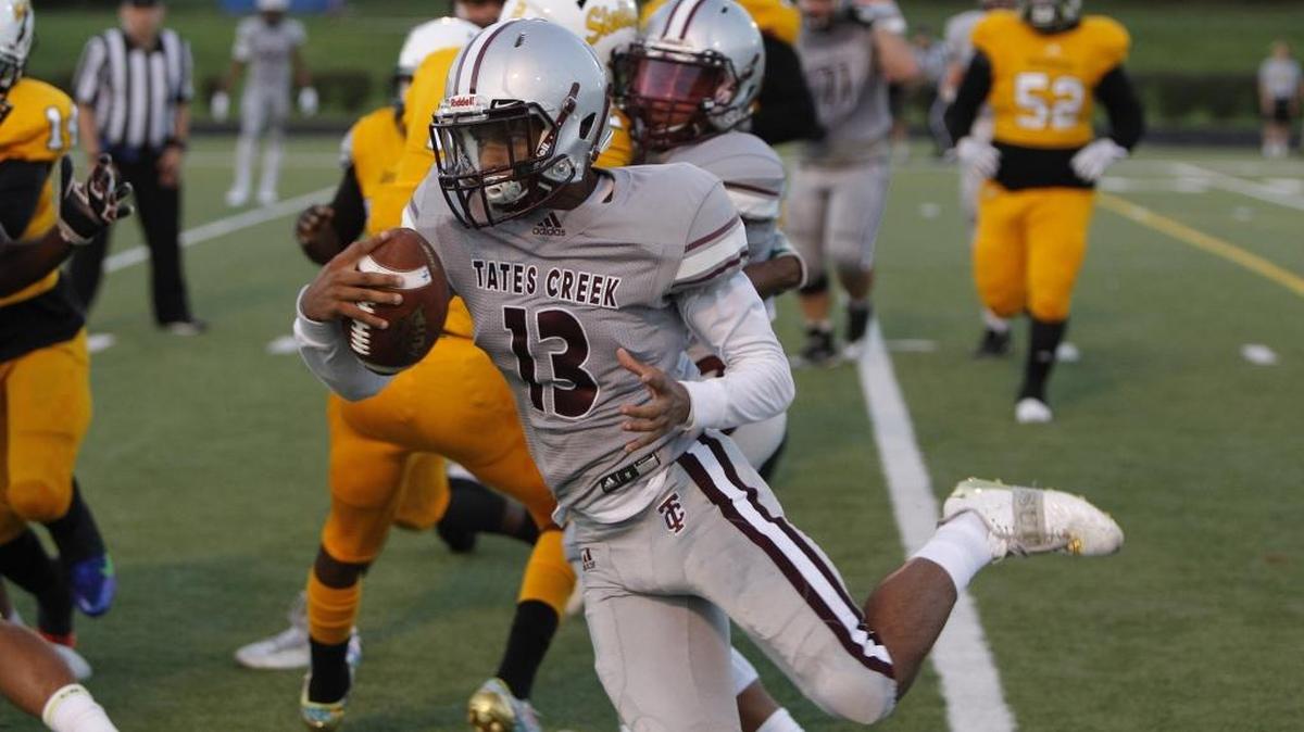 Tates Creek quarterback Mikaleb Coffey runs for a touchdown against Bryan Station at Tates Creek in Lexington, Ky., Friday, September 15, 2017.