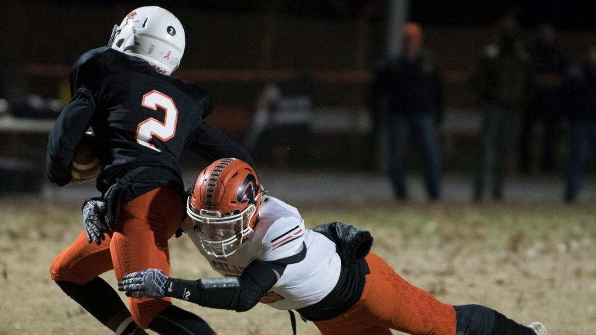 Raceland’s Gunnur Lewis tackled Paris High School’s Tyreeq Nebbitt during their Class A playoff game in Paris on Friday night.