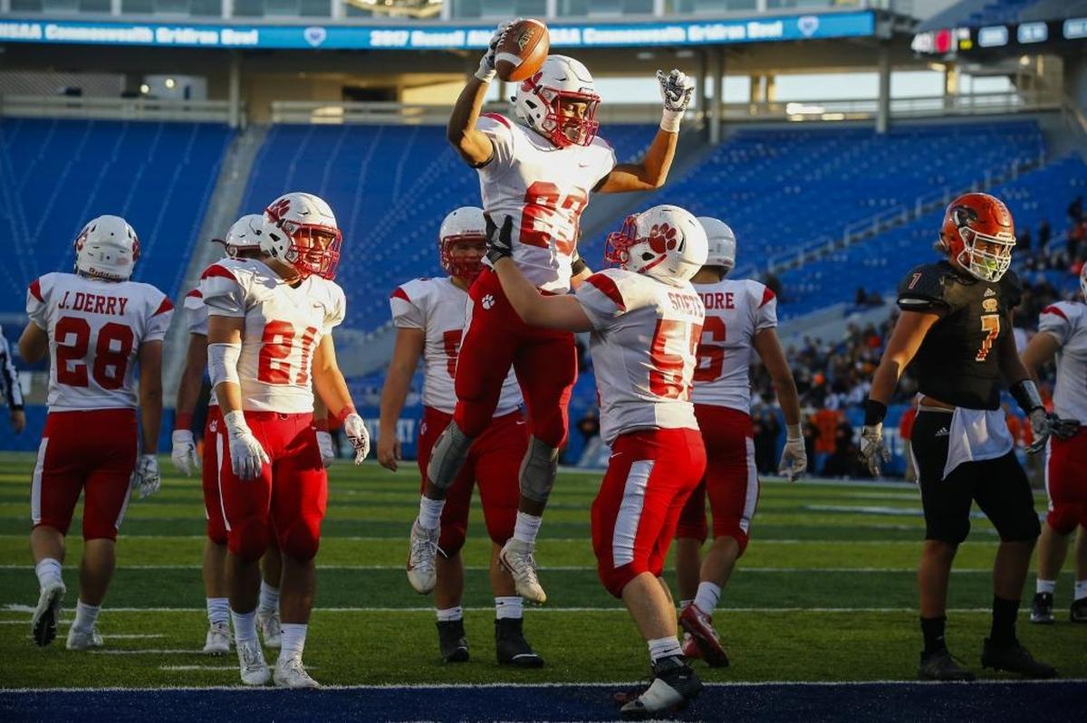 Beechwood's James Davis (23) celebrates a touchdown with teammate Blake Soete (57) during the Class A Russell Athletic/KHSAA Commonwealth Gridiron Bowl championship game against Raceland at Kroger Field in Lexington, Ky., Friday. Dec.1, 2017. Beechwood beat Raceland 41-0.