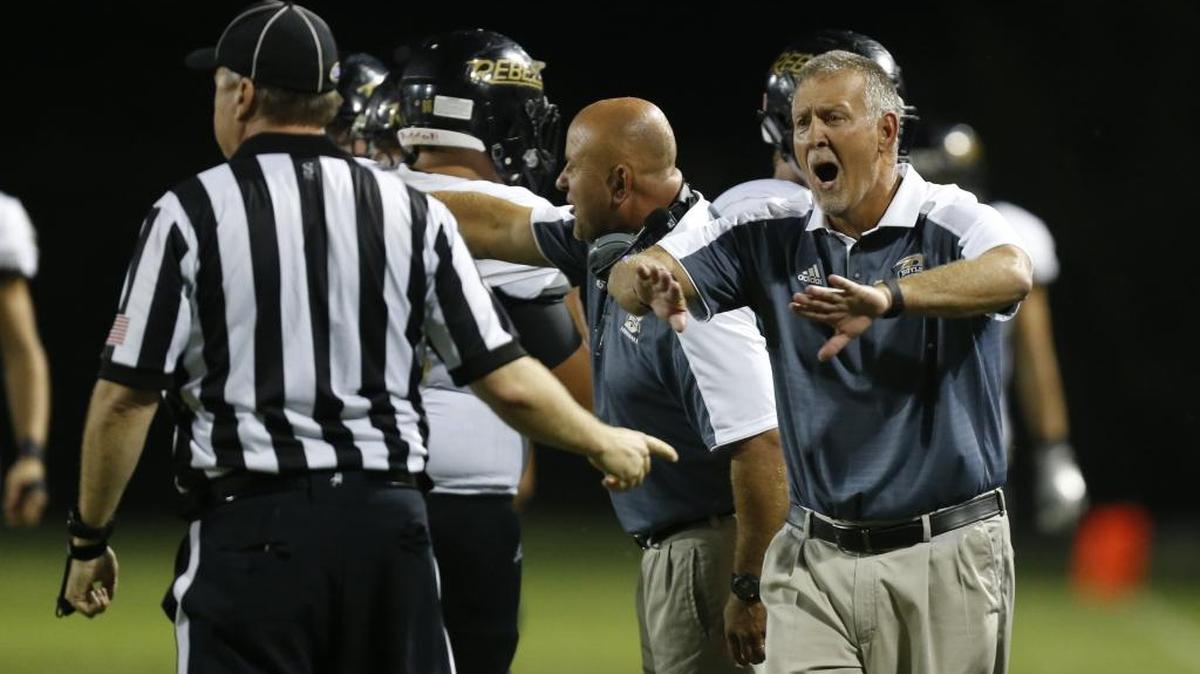 Boyle County Rebels head coach Chuck Smith argues with a referee against the Danville Admirals at Danville Admirals Stadium in Danville, Ky., on Thursday, August 31, 2017.