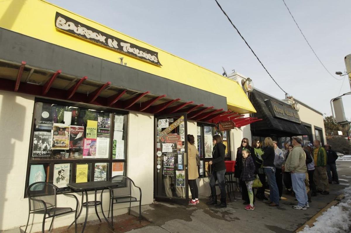 A line formed for food at Bourbon 'n Toulouse's Fat Tuesday party on Euclid in Lexington, Ky., on March 4, 2014.