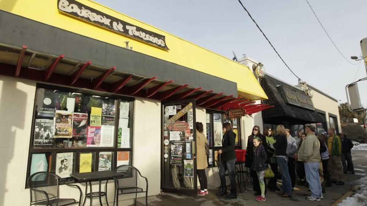 A line formed for food at Bourbon ‘n Toulouse’s Fat Tuesday party on Euclid in Lexington, Ky., on March 4, 2014.