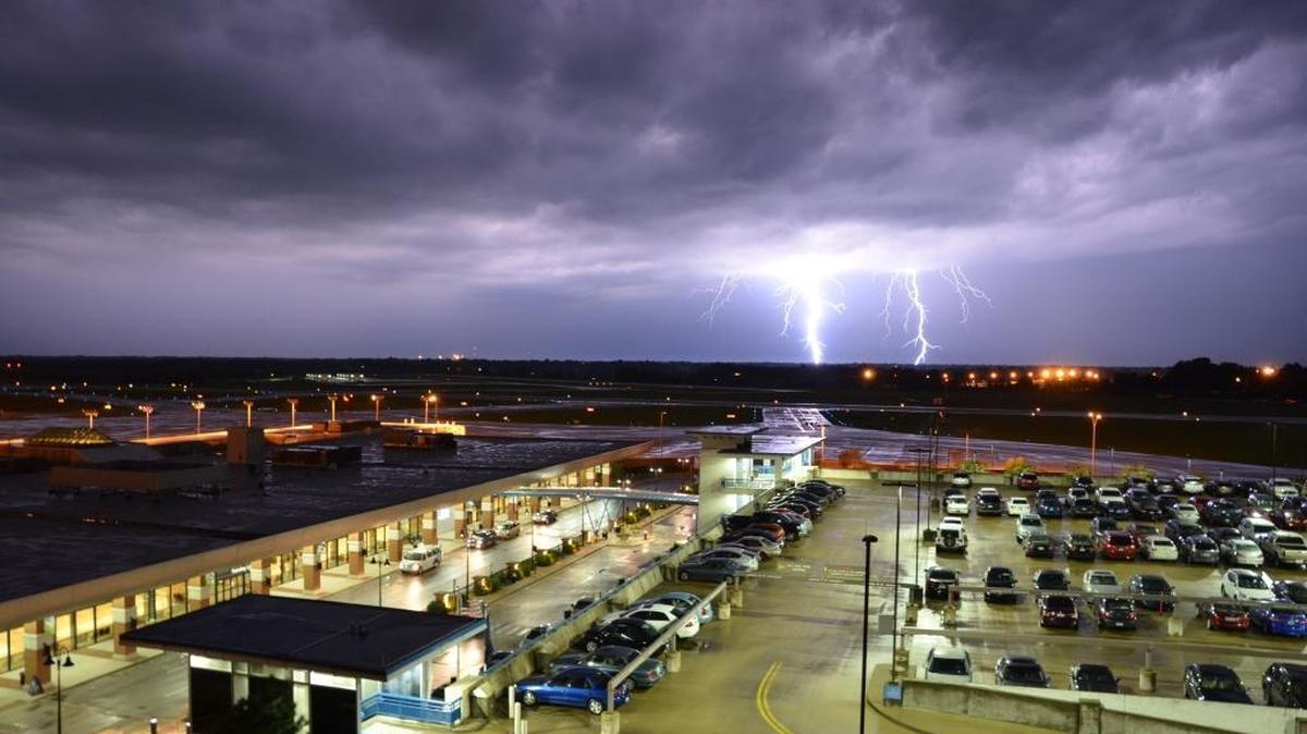 Multiple lightning strikes were visible as a thunderstorm approached Blue Grass Airport Monday night, July 13, 2015.