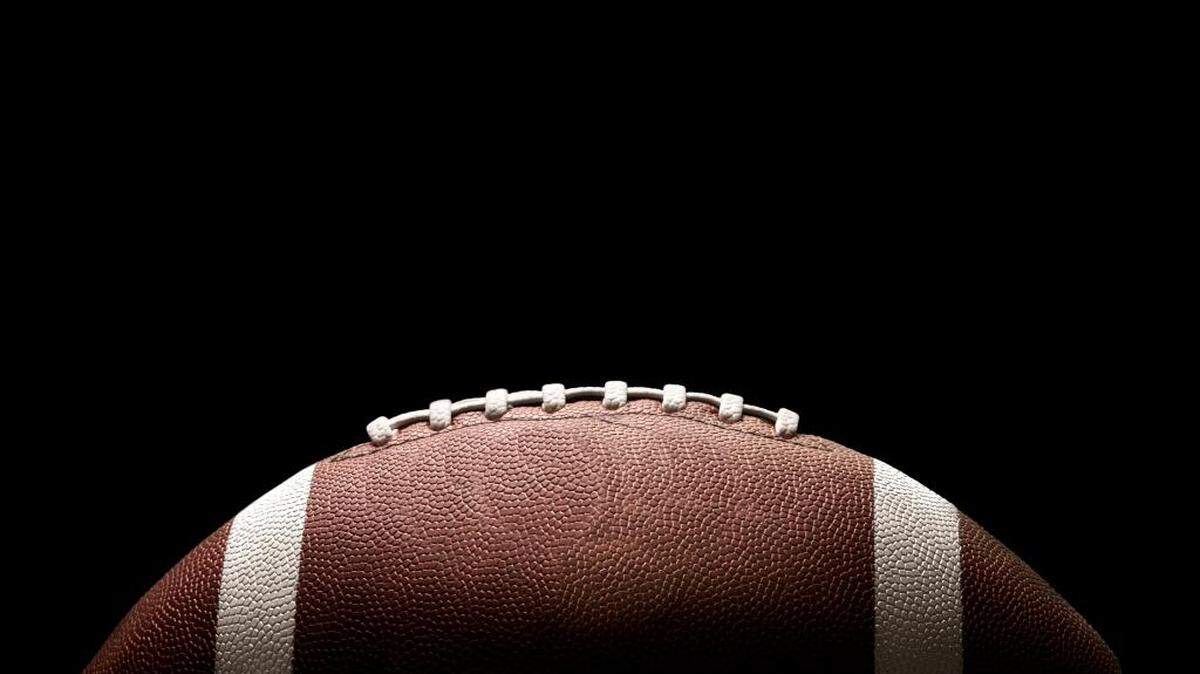 The father of one of the players allegedly placed a 16-year-old football coach in a chokehold.