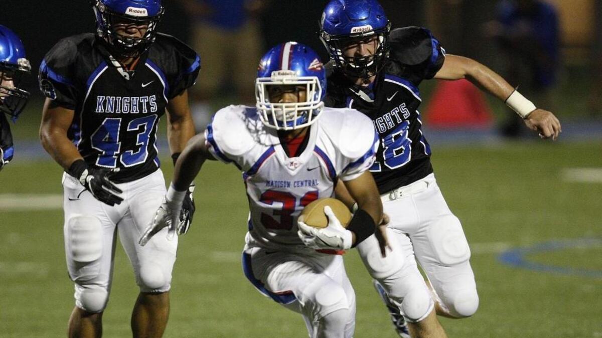 Madison Central's Antwaun Warford runs against Lexington Catholic in Lexington, Ky., Friday, September 16, 2016.