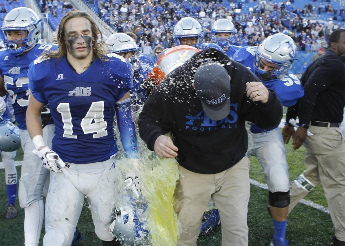 Danville head coach Clay Clevenger gets drenched with Gatorade after defeating Mayfield to win the Class 2A Russell Athletics KHSAA Commonwealth Gridiron Bowl at Kroger Field in Lexington, Ky., Saturday, December 2, 2017.