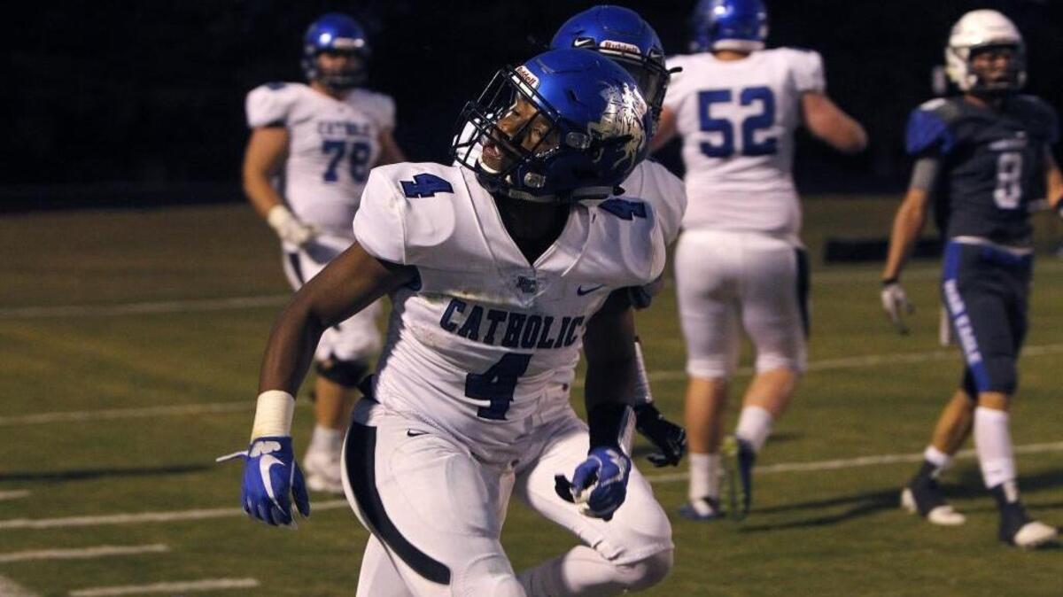 Lexington Catholic's Dameon Jones has some words for the Lexington Christian fans after scoring at Lexington Christian Academy in Lexington, Ky., Friday, September 8, 2017.