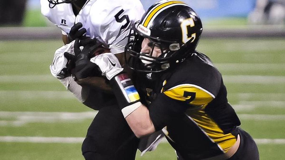 South Warren's Bryan Cummings (5) intercepts a pass intended for Johnson Central's Geordan Blanton (7) during the KHSAA Class 4A championship high school football game in Bowling Green, Ky., Sunday, Dec. 6, 2015.