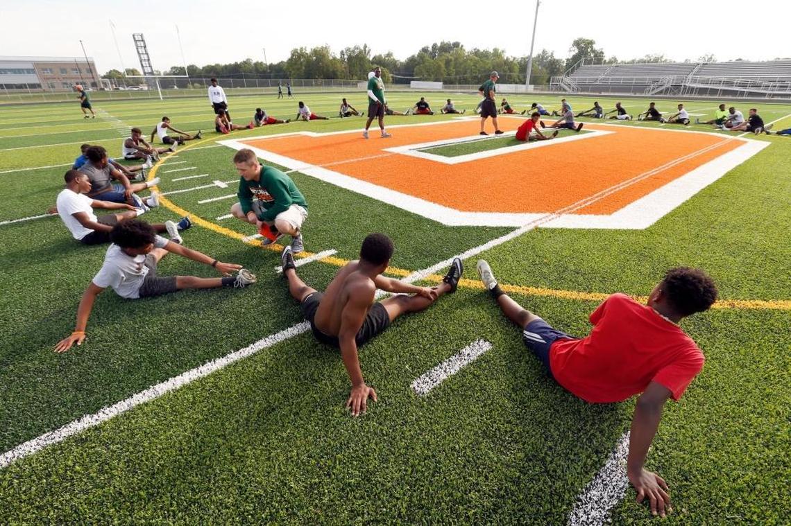 The team stretched during Frederick Douglass High School’s football practice at the new school, 2000 Winchester Rd. in Lexington, Ky., Friday, July 14, 2017. The school will open this fall.