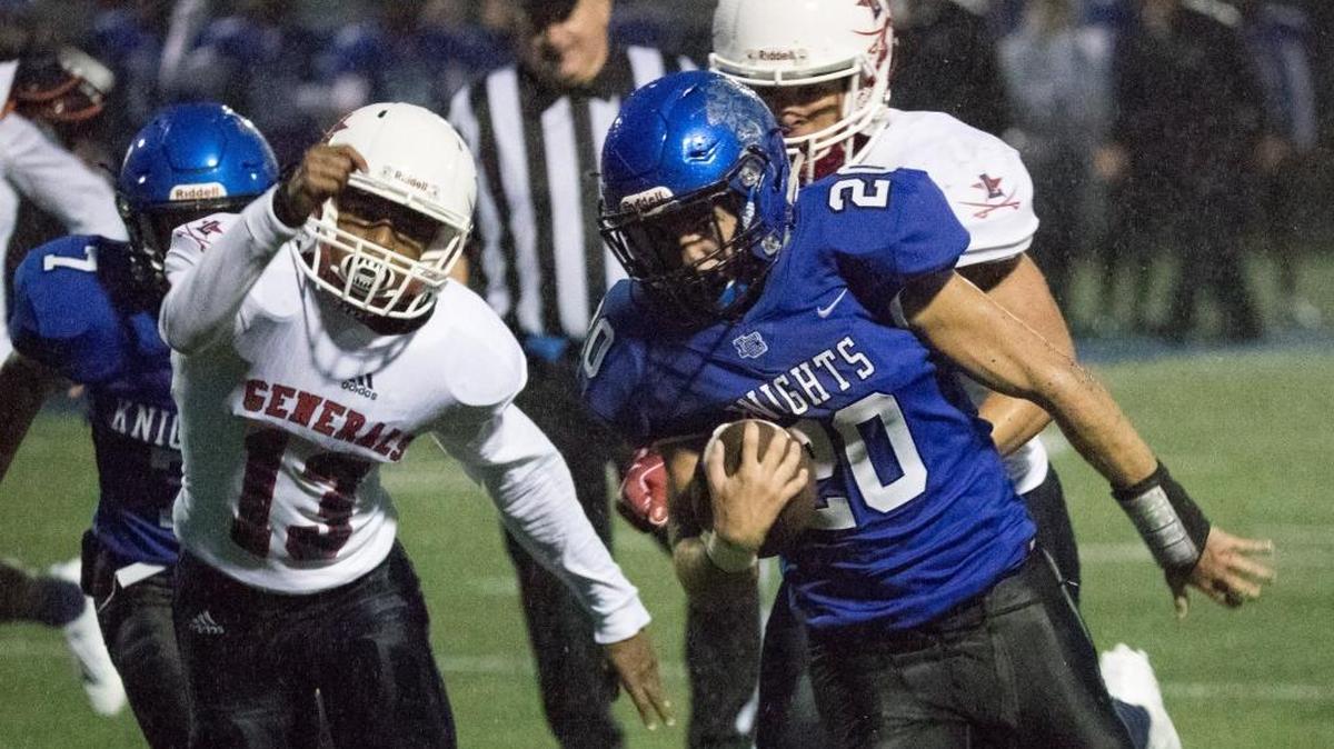 Lexington Catholic's Keith Brinkman (20) carried the ball as Lexington Catholic hosted Lafayette on Friday Sept. 1, 2017 in Lexington, Ky.