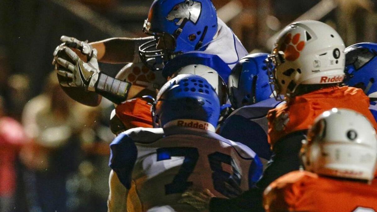 Bracken County's Griffin Appleman reaches across the goal line for a first half touchdown as the first half clock expires with Paris 14, Bracken County 7 at the half on Friday September 30, 2016 in Paris, Ky.