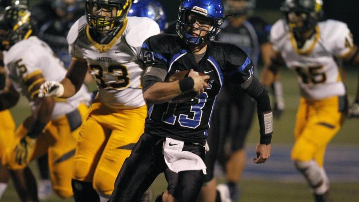 Lexington Catholic quarterback Kirk Fagot runs for a touchdown against Central during the Class 3A playoffs at Joseph K. Ford Stadium in Lexington, Ky., Friday, November 18, 2016.