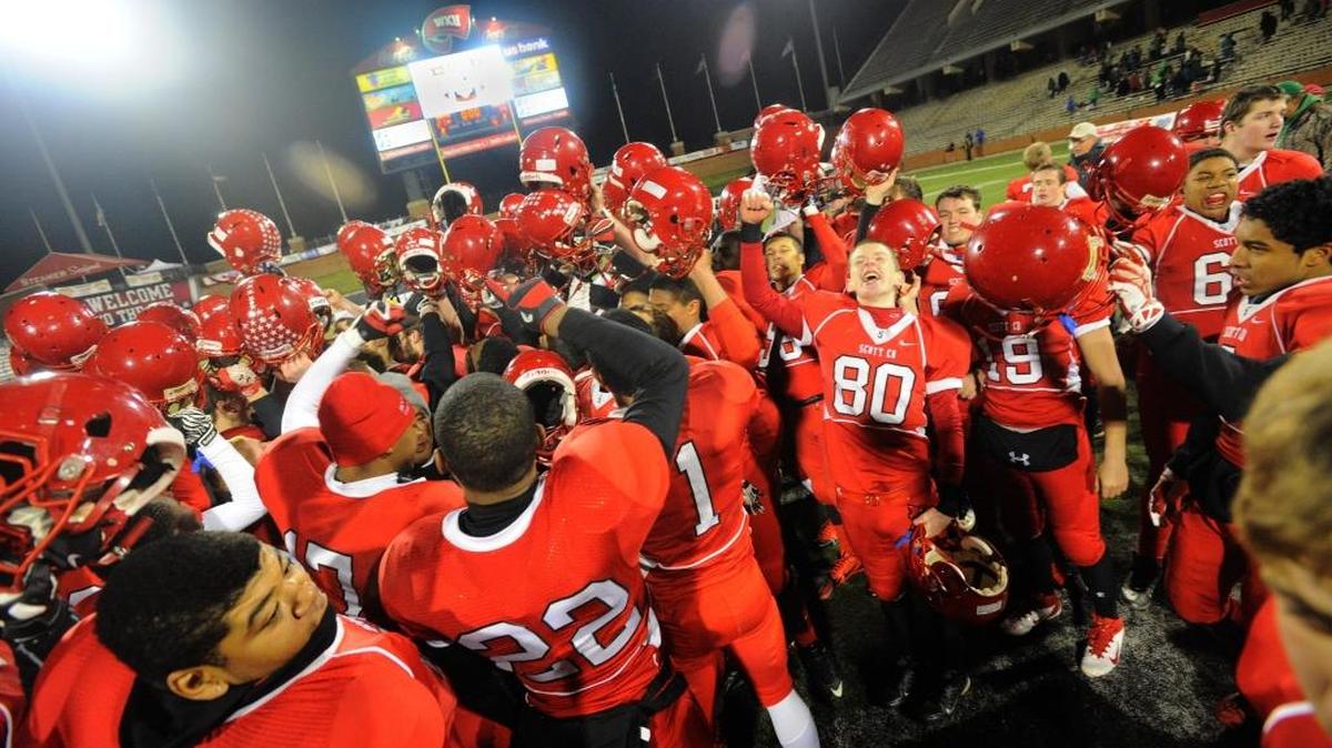 Scott County celebrates after defeating Meade County in the KHSAA Class 6A Commonwealth Gridiron Bowl championship high school football game Saturday, Dec. 7, 2013, in Bowling Green, Ky.