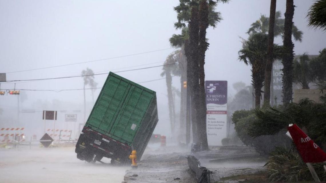 A power generator tips in front of Texas' CHRISTUS Spohn Hospital in Corpus Christi, Texas, as Hurricane Harvey hits Friday, Aug. 25, 2017. (Courtney Sacco /Corpus Christi Caller-Times via AP)