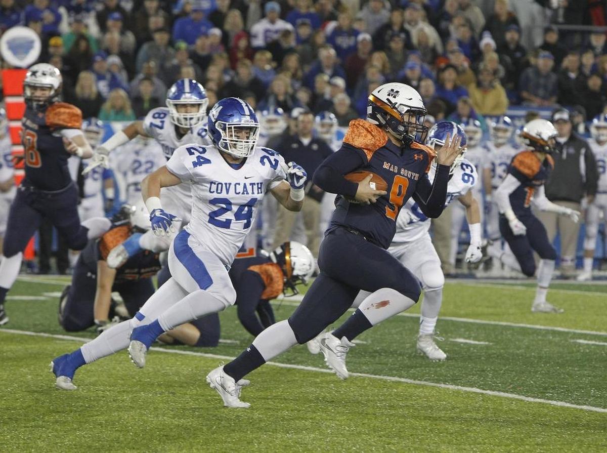 Madison Southern quarterback Landen Stacy runs on the keeper against Covington Catholic in the Class 5A Russell Athletics KHSAA Commonwealth Gridiron Bowl at Kroger Field in Lexington, Ky., Saturday, December 2, 2017.