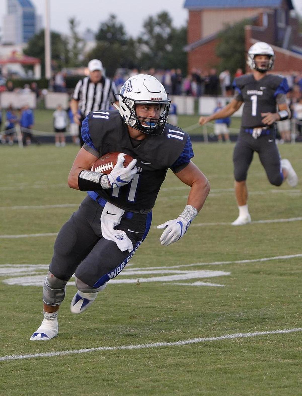 LCA's Wade Drake runs against Lexington Catholic at Lexington Christian Academy in Lexington, Ky., Friday, September 8, 2017.