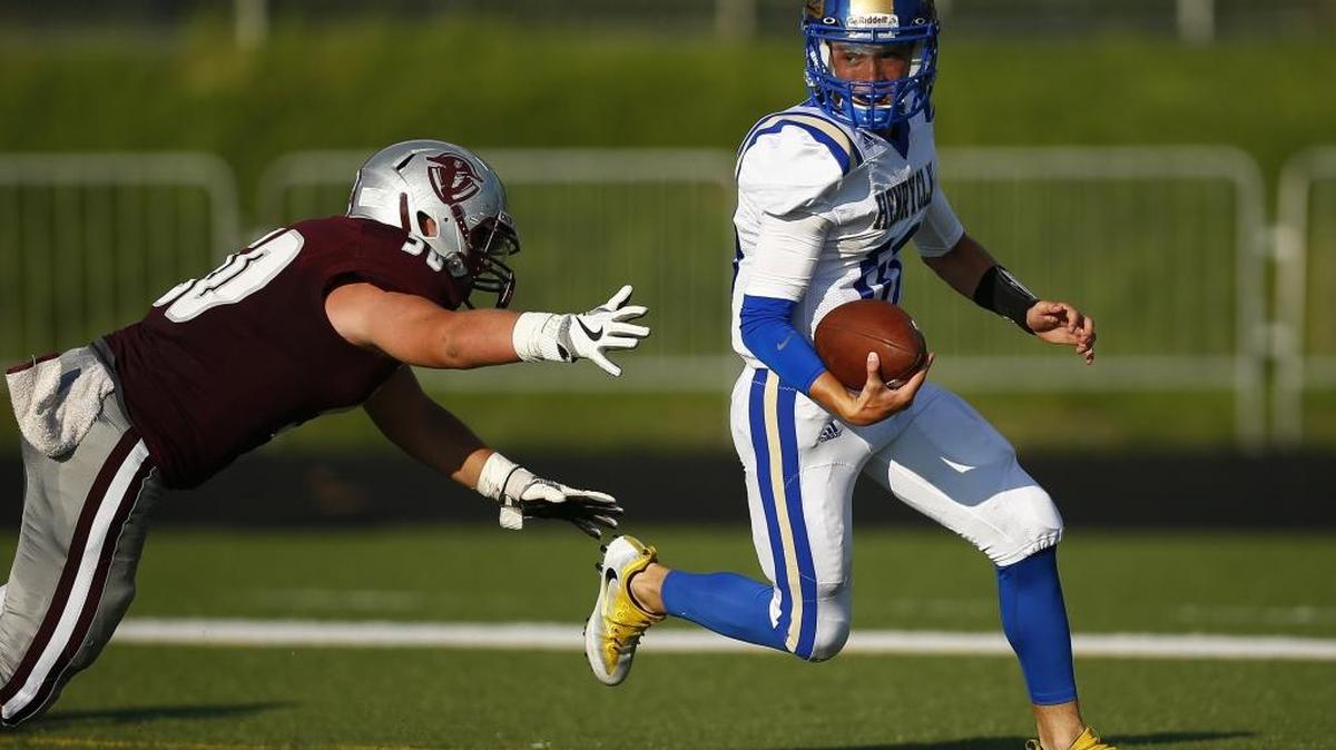 Henry Clay's Darrin Van Horn (10) runs the ball past Tates Creek's Haydon Gant (50) in the second quarter of their game during the Adidas Kickoff Classic at Tates Creek High School, Friday, Aug. 18. 2017.