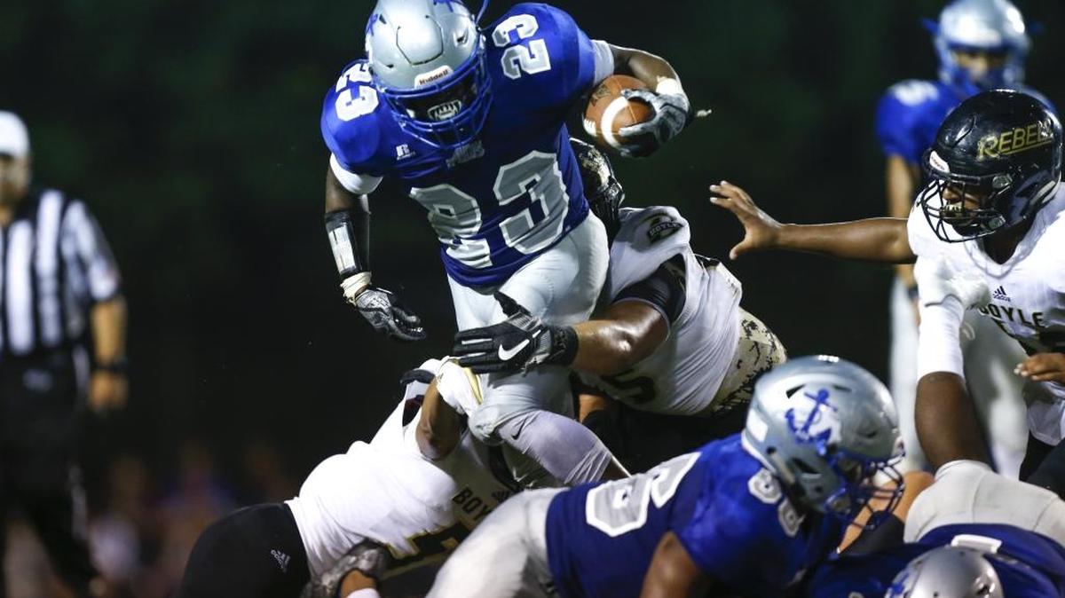 Danville Admirals running back Donleavy Harris #23 jumps over the defense against the Boyle County Rebels at Danville Admirals Stadium in Danville, Ky., on Thursday, August 31, 2017.