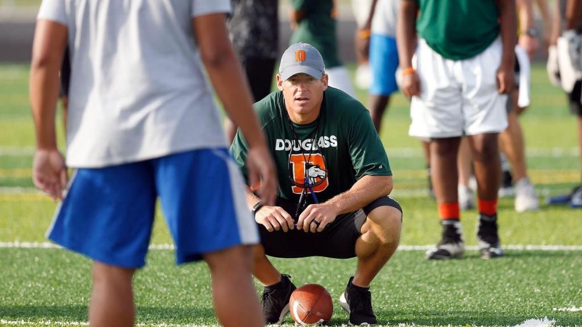 Head coach Brian Landis observed his new team during a Frederick Douglass High School football practice in Lexington on Friday.