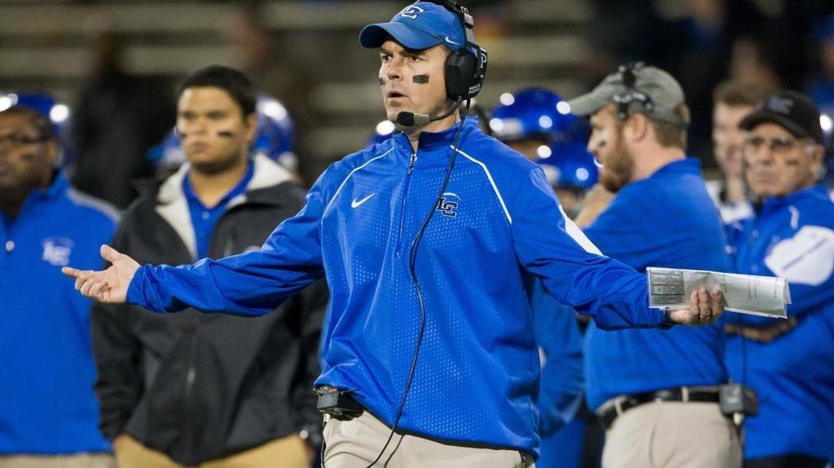 Lexington Catholic head coach Mark Perry questions a call by the officials in the first half. The Lexington Catholic Knights played the Belfry Pirates in the KHSAA Commonwealth Gridiron Bowl, Class 3A Championship, Sunday, Dec. 06, 2015 at L.T. Smith Stadium in Bowling Green.