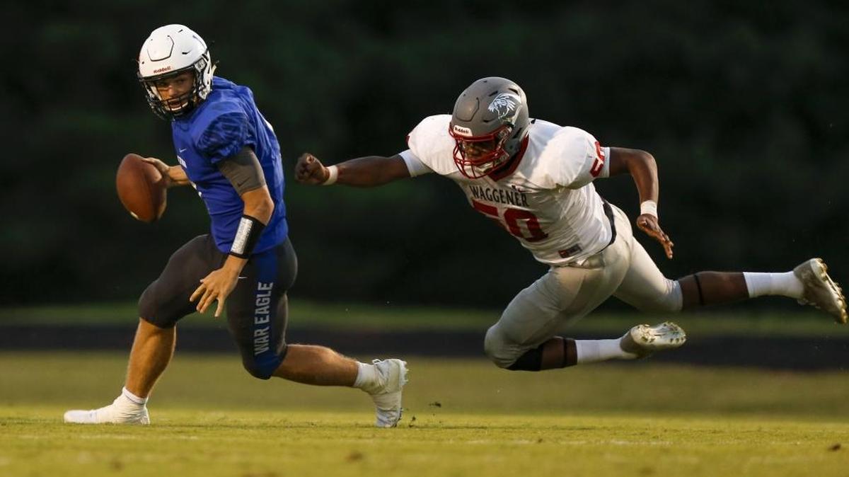 Lexington Christian quarterback Logan Nieves avoids a sack from Waggener defensive lineman Greg Snow at Lexington Christian Academy in Lexington, KY., on Saturday, August 19, 2017.