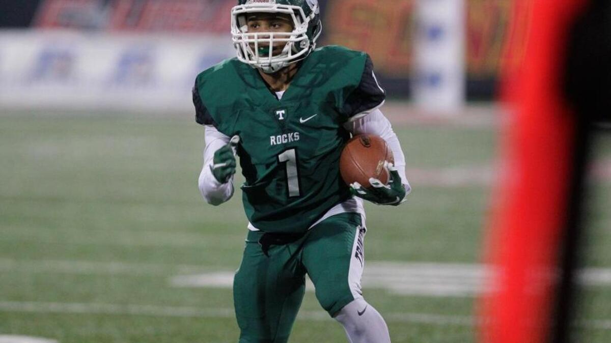 Rondale Moore ran down the sideline for Trinity against Lafayette in the Class 6A title game last December. Moore is one reason the Shamrocks are expected to repeat.