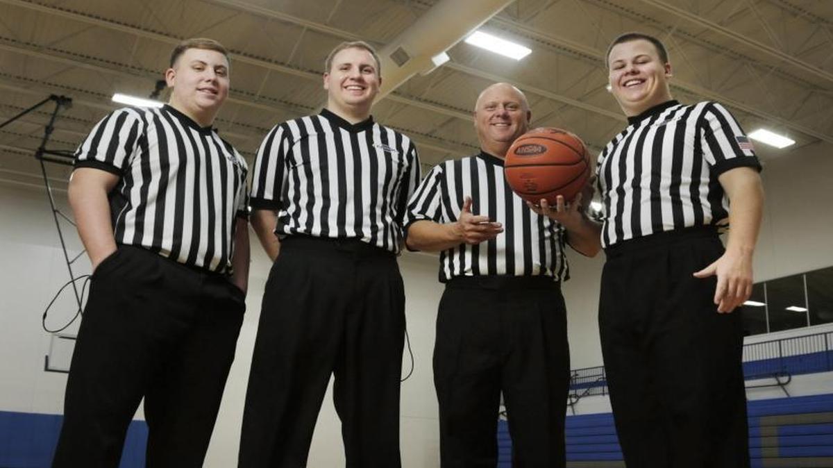 Kenny Gant, second from right, and sons Haydon, left, Marshall, second from left and Robert, at right posed for a photo at Lexington Christian Academy on Jan. 5, 2017. All three of Kenny's sons are referees.
