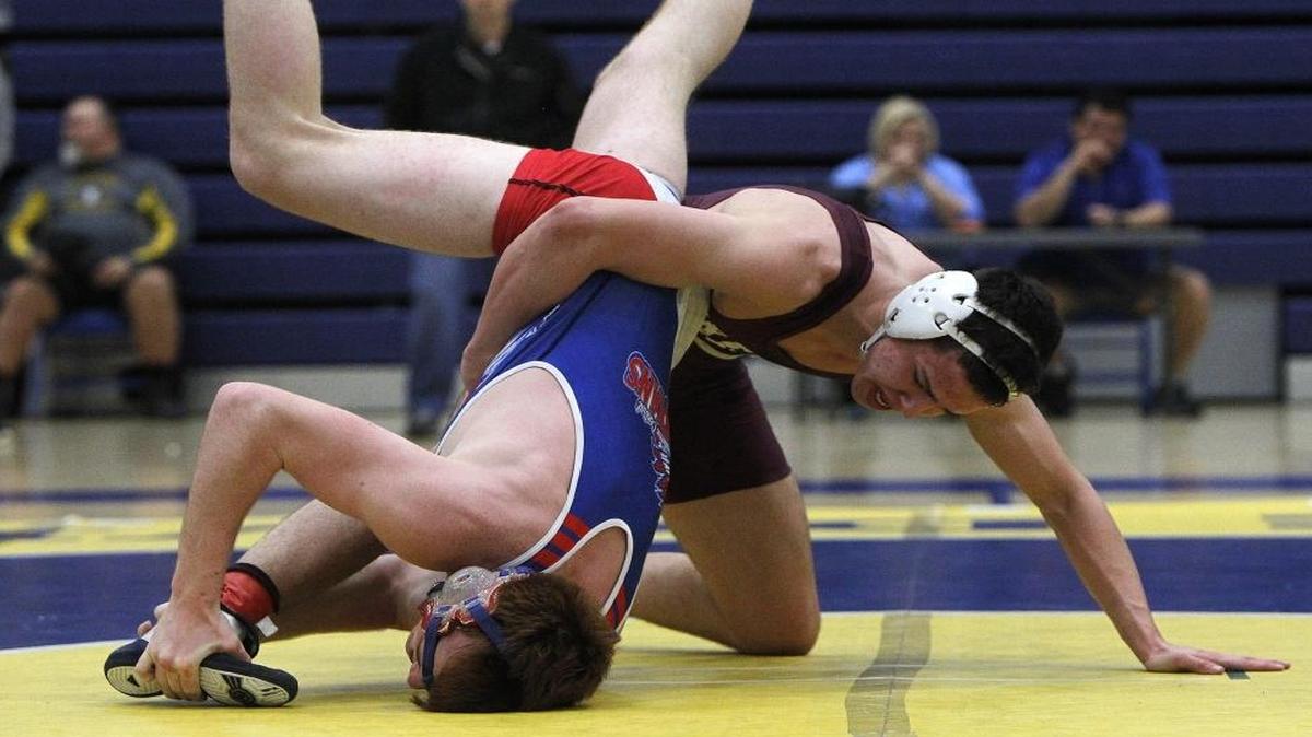 Tates Creek's Brady Gibson wrestles Madison Central's Dylan Mays in the 160-lb weight class final at the 7th region wrestling championship at in the gym at Henry Clay high school in Lexington, Ky., Saturday, February 11, 2017.