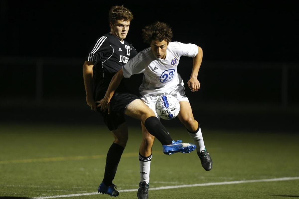 Henry Clay midfielder Nafiz Budieri #23 battles Paul Laurence Dunbar back Nathan Williams during the boy's soccer match at Henry Clay High School in Lexington, Ky., on Tuesday, August 29, 2017.