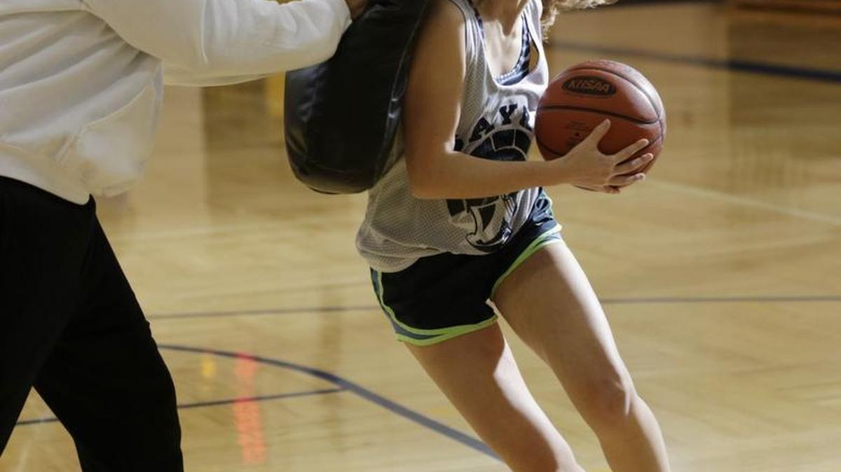 Head coach Scott Sutton put pressure on Ellie Alford (22) during girls basketball practice at Sayre School in Lexington, Ky., on Jan. 12, 2016.