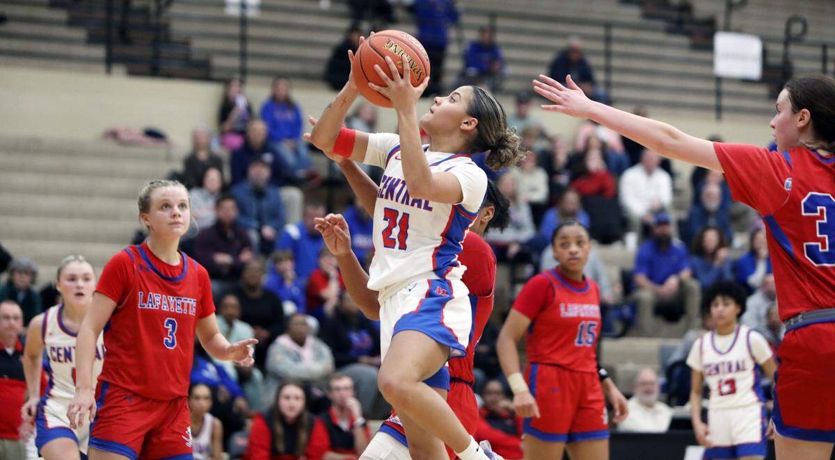 Madison Central’s Nataya Strader goes to the basket unchallenged by Lafayette defenders during the girls 11th Region Tournament semifinals at Paul Laurence Dunbar High School’s S.T. Roach Sports Center on Thursday.