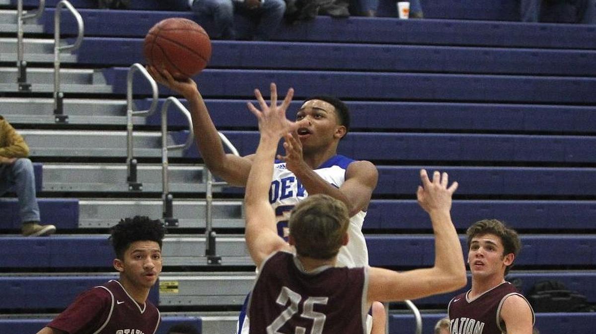Henry Clay's Justin Mitchell shot against Station Camp during the Peoples Exchange Bank Holiday Invitational at Henry Clay in Lexington, Ky., Tuesday, December 20, 2016.