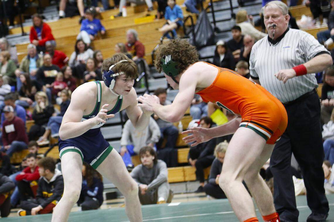 Great Crossing’s Rowdy Benner, left, squared off against Frederick Douglass’ Anthony Condi in the 126 finals at the Region 6 Championships at Frederick Douglass High School on Saturday.