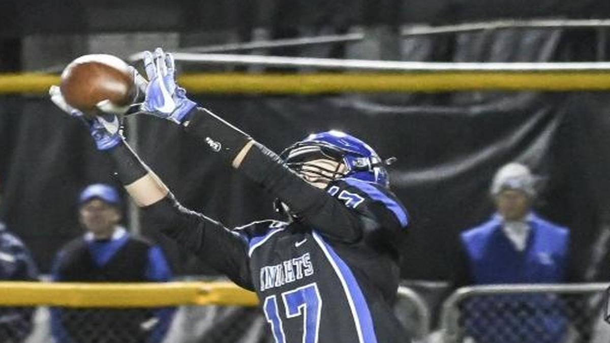 Lexington Catholic receiver Bo Bennington (17) caught a pass in front of Bardstown’s Kel Livers during the Knights’ 53-14 romp in the Class 3A second round on Friday.