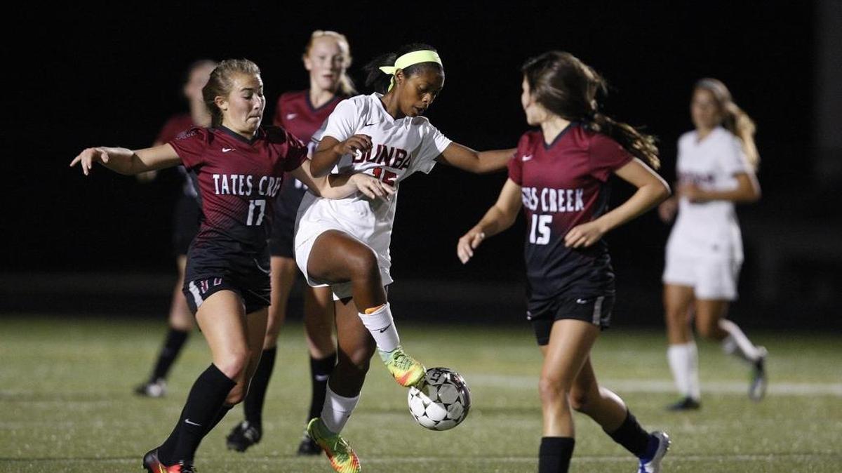 Tates Creek's Haley Poynter defends against Paul Laurence Dunbar's Merin Roach in the 43rd district semifinal at Ishmael Stadium in Lexington, Ky., Tuesday, October 11, 2016.