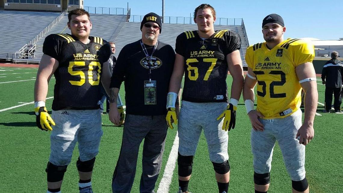 Coach Phil Hawkins, second from left, posed with Drake Jackson of Woodford County, Landon Young of Lafayette and Kash Daniel of Paintsville on the first day of practice for the 2016 U.S. Army All-American Bowl. The players would go on to play for the University of Kentucky. Hawkins has recently been named head coach at Bryan Station.