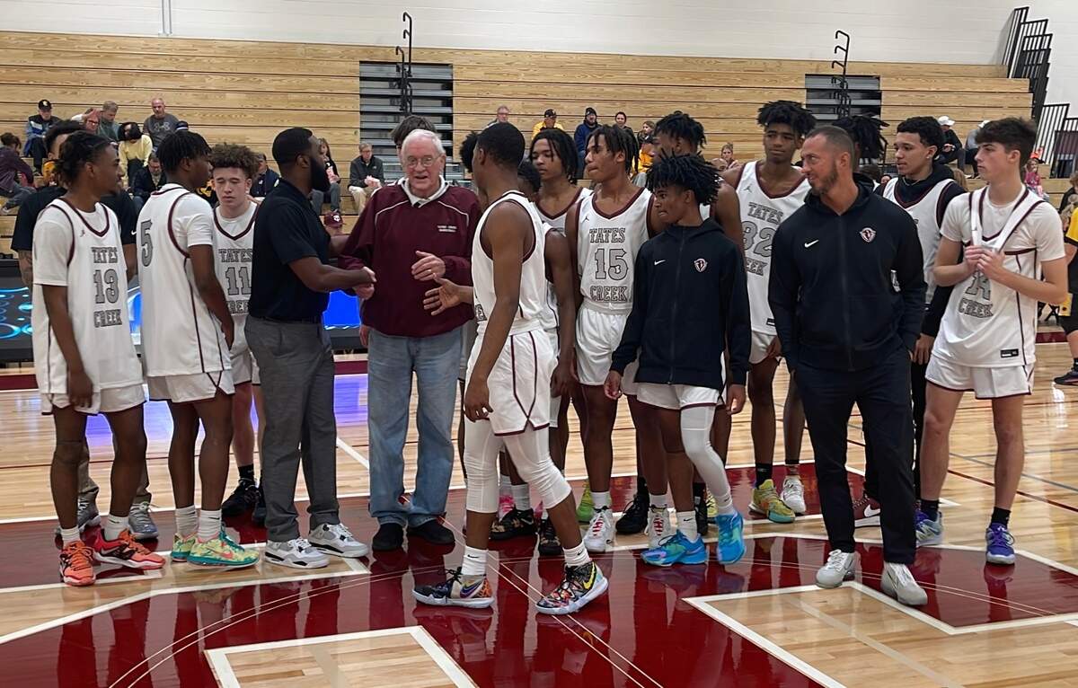 Tates Creek High School boys’ basketball players and coaches took part in the recognition of former Commodores coach Nolan Barger as they prepared to play their first game in the new Nolan Barger Gymnasium on Nov. 29, 2022. Barger led Tates Creek to 540 wins during his 28-year career.