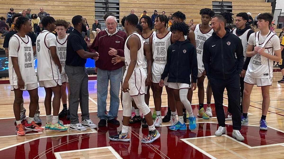 Tates Creek High School’s boys’ basketball players and coaches took part in the recognition of former Commodores’ coach Nolan Barger as they prepared to play their first game in the new Nolan Barger Gymnasium. Barger led Tates Creek to 540 wins during his 28-year career.