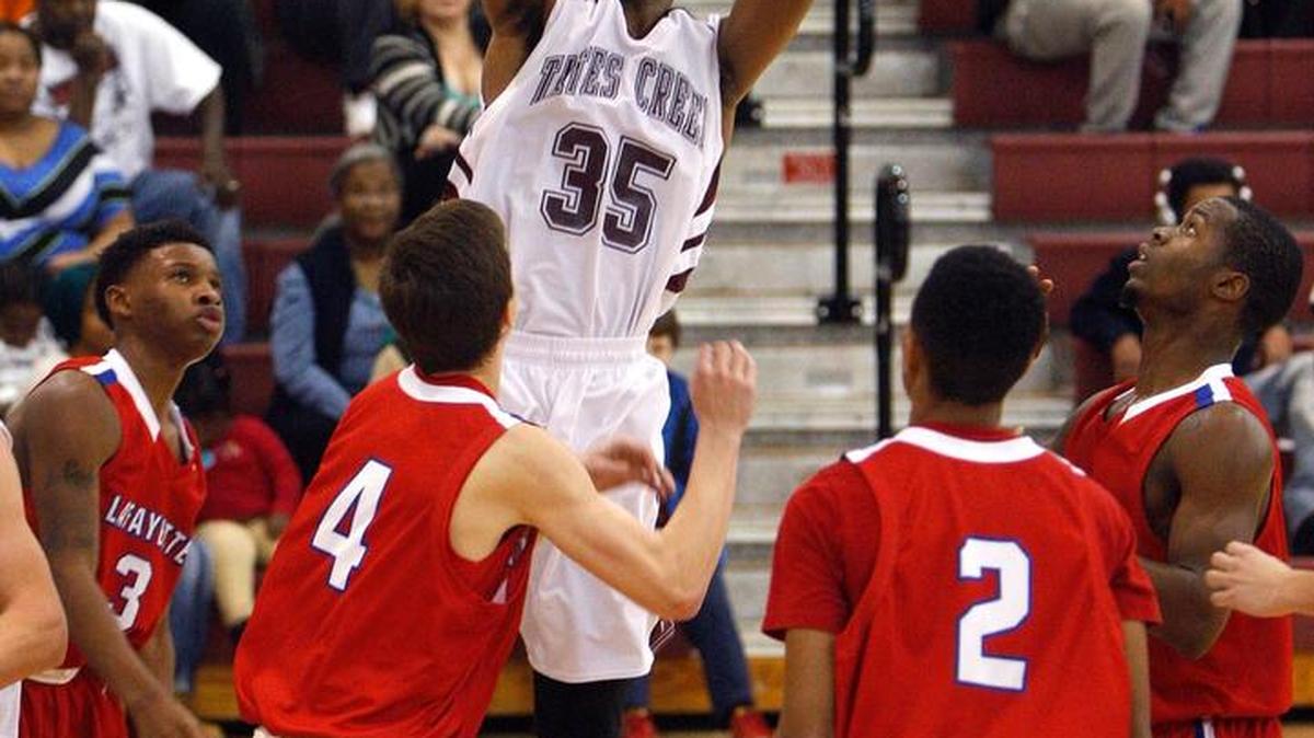 Tates Creek's Isaiah Patterson shoots in the first half against Lafayette in the Nolan Barger Gymnasium at Tates Creek High School in Lexington, Ky., Tuesday evening, December 16, 2014.